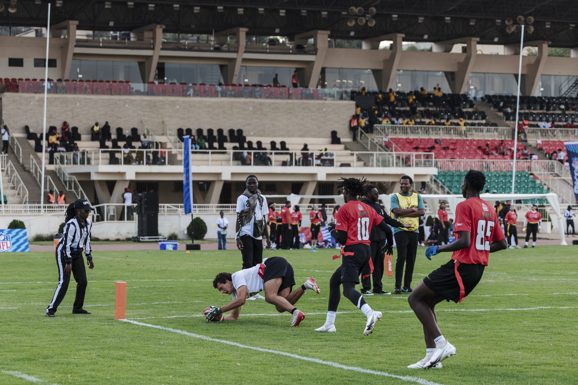 Flag football player scoring a touchdown